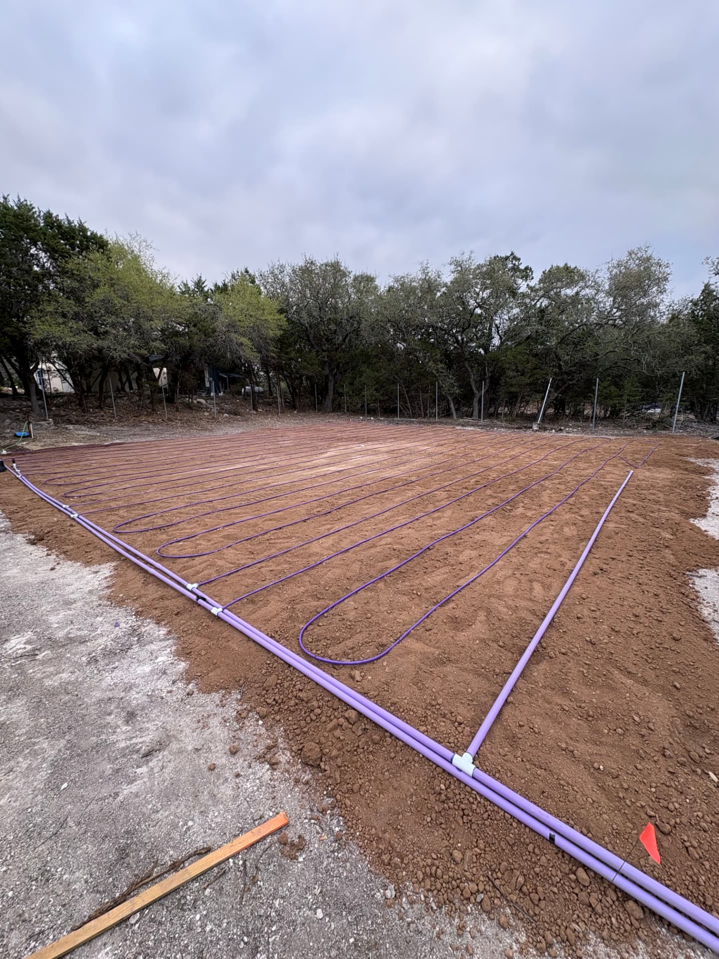 Complete drip irrigation field with supply and return manifolds
